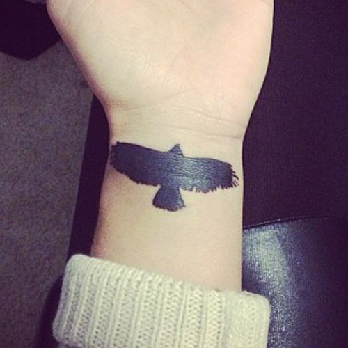 Black Silhouette Flying Eagle Tattoo On Forearm by Niykee Heaton