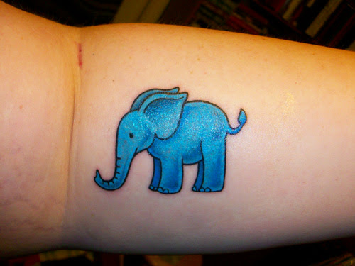 Blue Ink Elephant Tattoo On Forearm