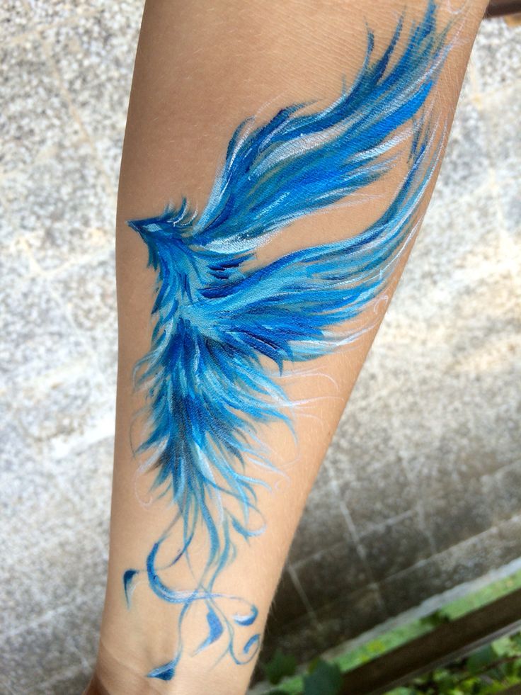 Blue Ink Flying Phoenix Tattoo On Forearm