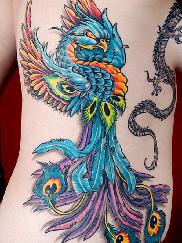 Blue Ink Phoenix Tattoo On Side Rib