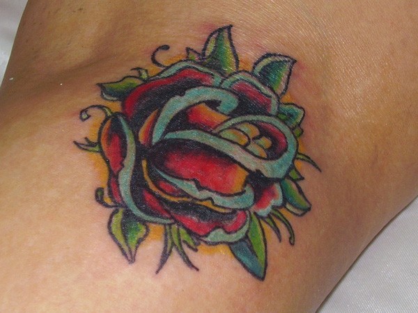 Blue Shaded Rose Tattoo On Arm