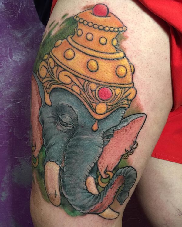 Colored Elephant With Crown Tattooed On Thigh