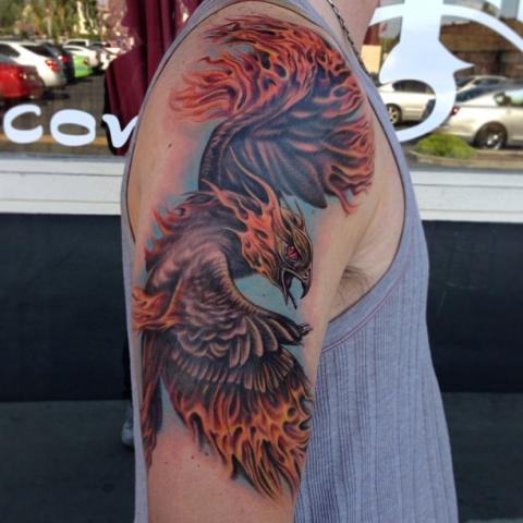 Colored Flying Phoenix Tattoo On Right Half Sleeve