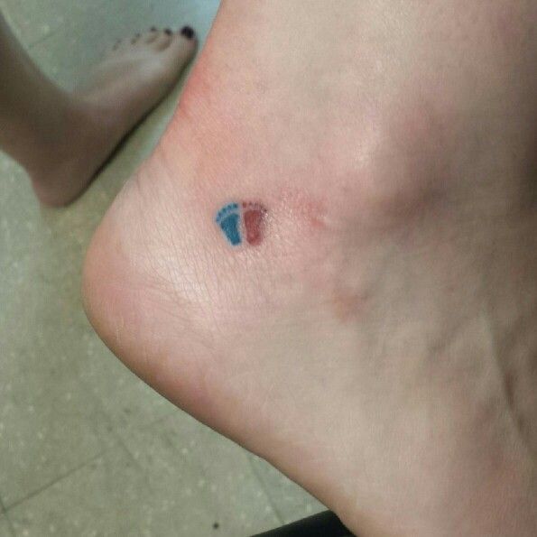 Colorful little feet tattoo on toe