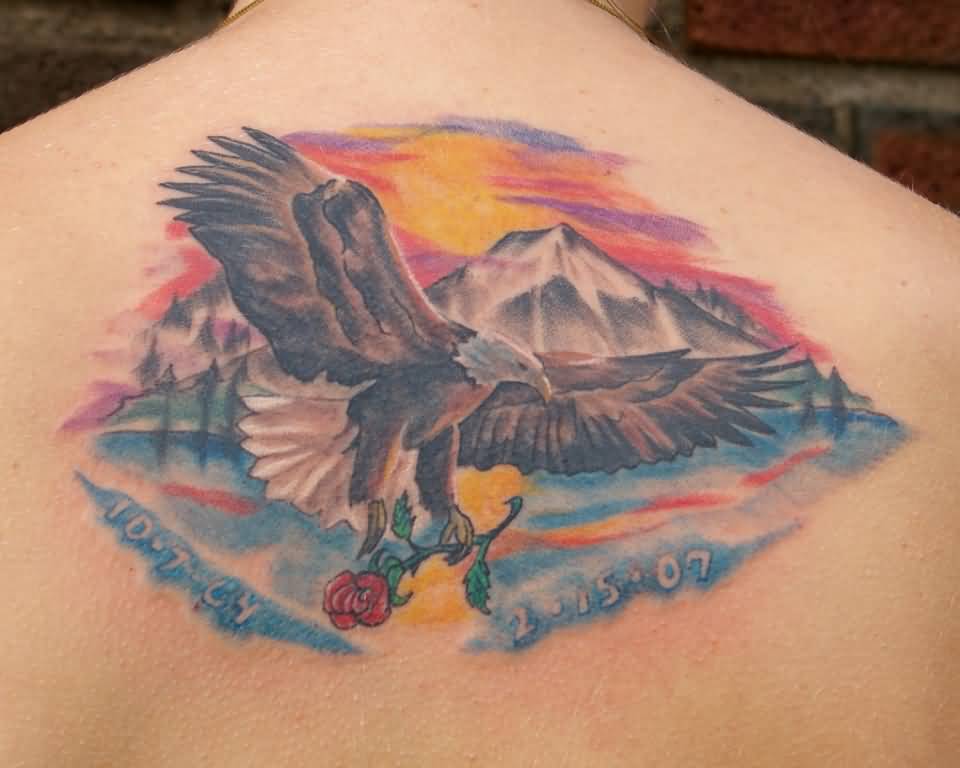 Eagle Flying With Rose In Claws Memorial Tattoo On Back