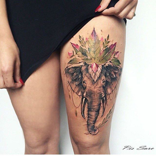 Elephant Head With Leaves Tattoo On Left Thigh