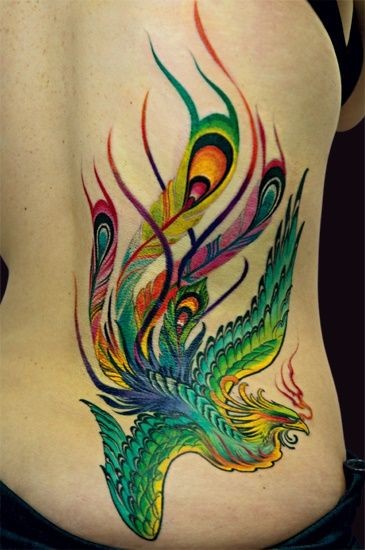 Green And Yellow Ink Flying Phoenix Tattoo On Side Rib