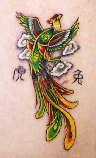 Green And Yellow Ink Flying Phoenix Tattoo