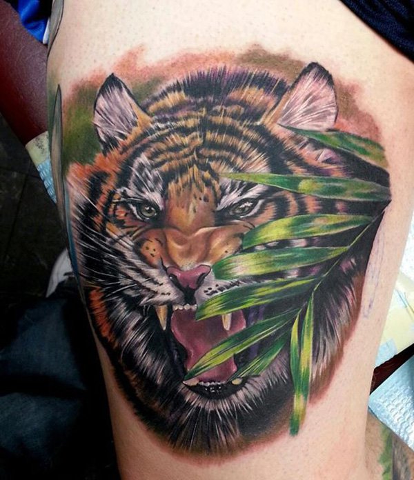 Green Leaves And Colored Tiger Tattoo On Thigh
