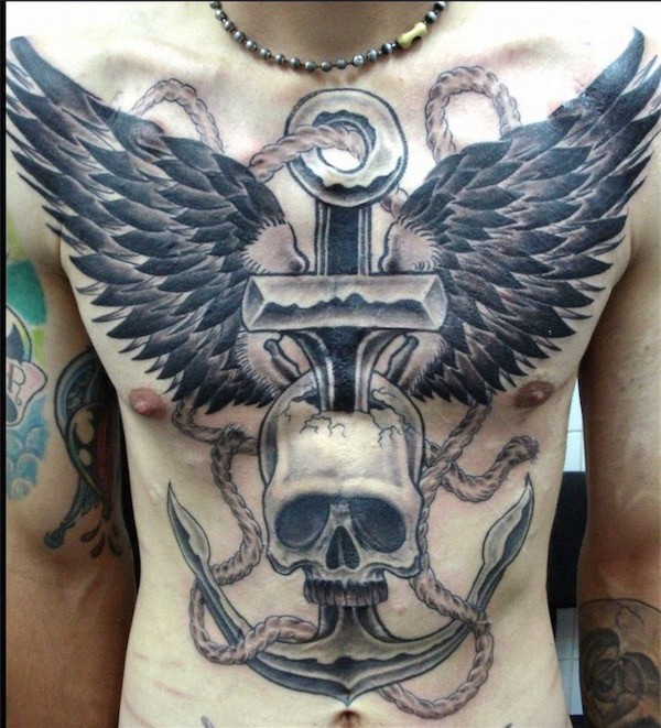 Grey And Black Anchor Pierced In Skull With Eagle wings Tattooed On Chest