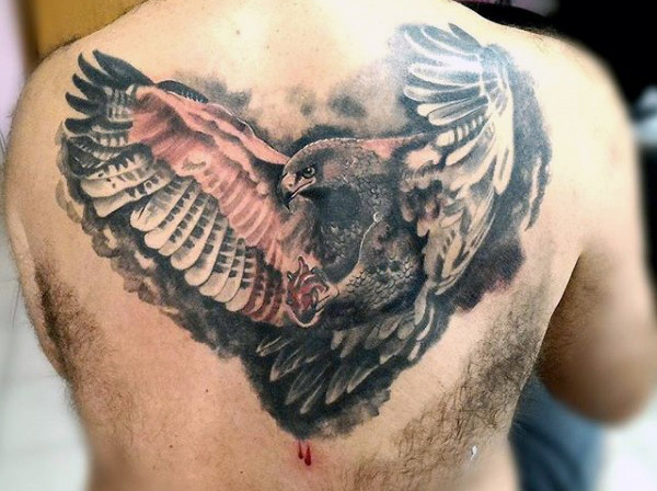 Grey And Black Flying Eagle Tattoo On Back