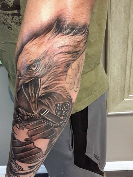 Grey And Black Ink Angry Eagle Head Tattooed On Left Sleeve