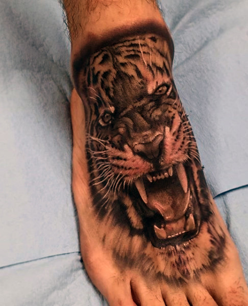 Grey Ink Angry Tiger Tattoo On Right Foot