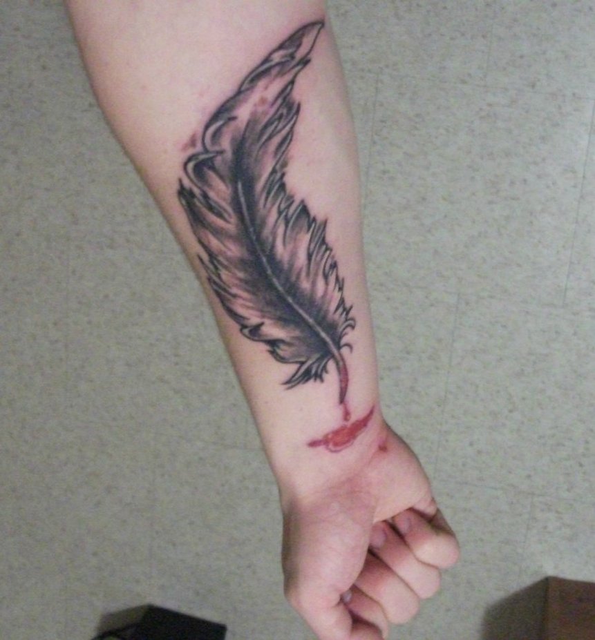 Grey Ink Eagle Feather Tattooed On Forearm