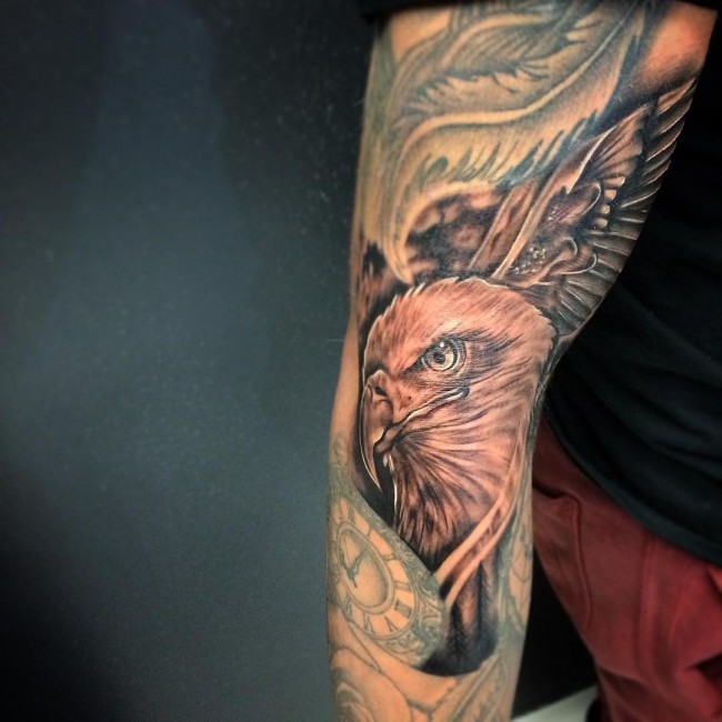 Grey Ink Eagle Head Tattoo On Arm Sleeve
