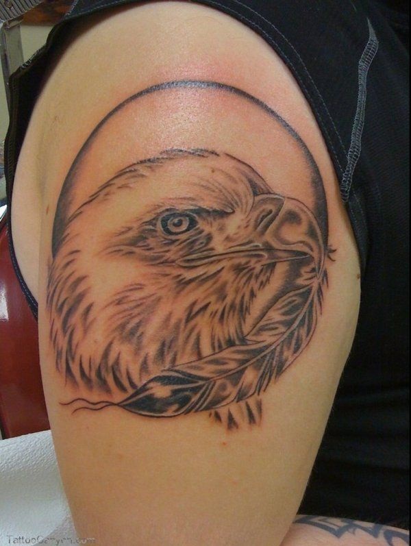Grey Ink Feather And Eagle Head Tattoo On Shoulder