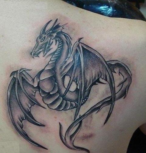 Grey Ink Flying Dragon Tattoo On Back Shoulder