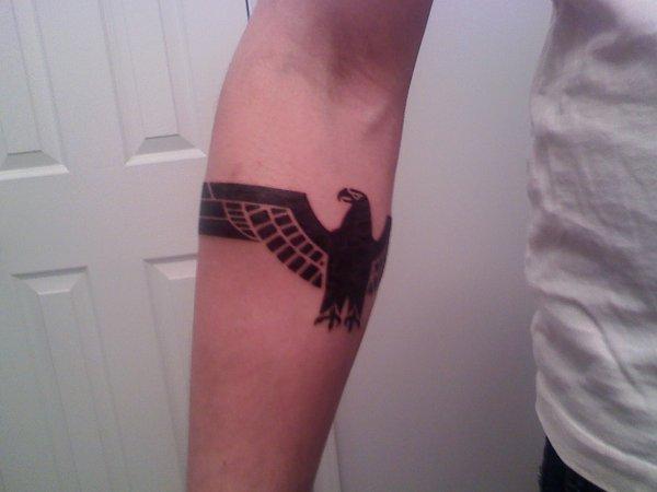 Halda Eagle Wings Spread Out Tattooed On Forearm