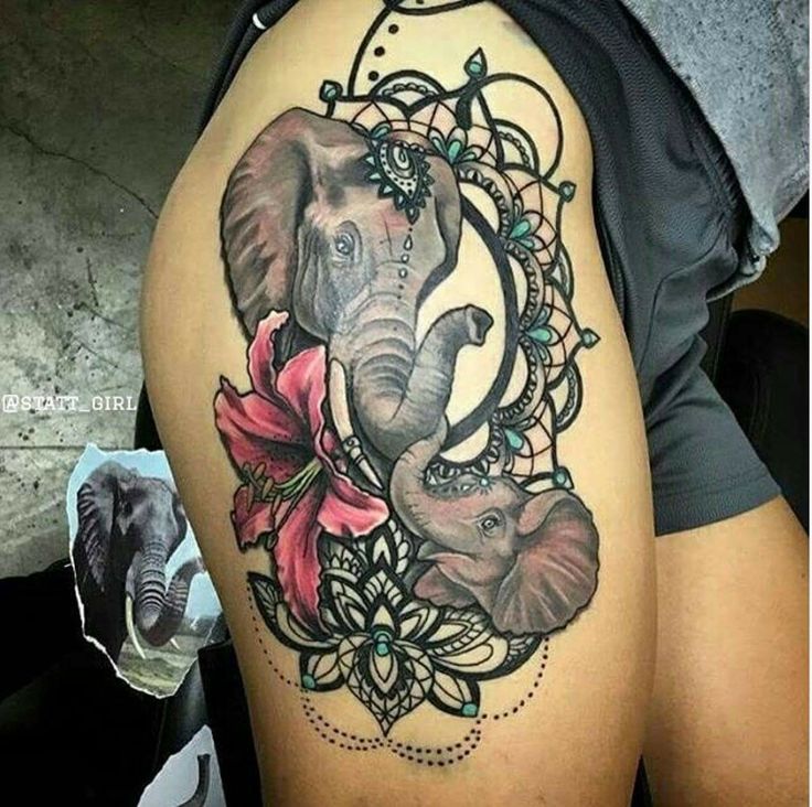 Lily Flower And Elephant Heads With Mirror Frames Tattoo On Side Thigh