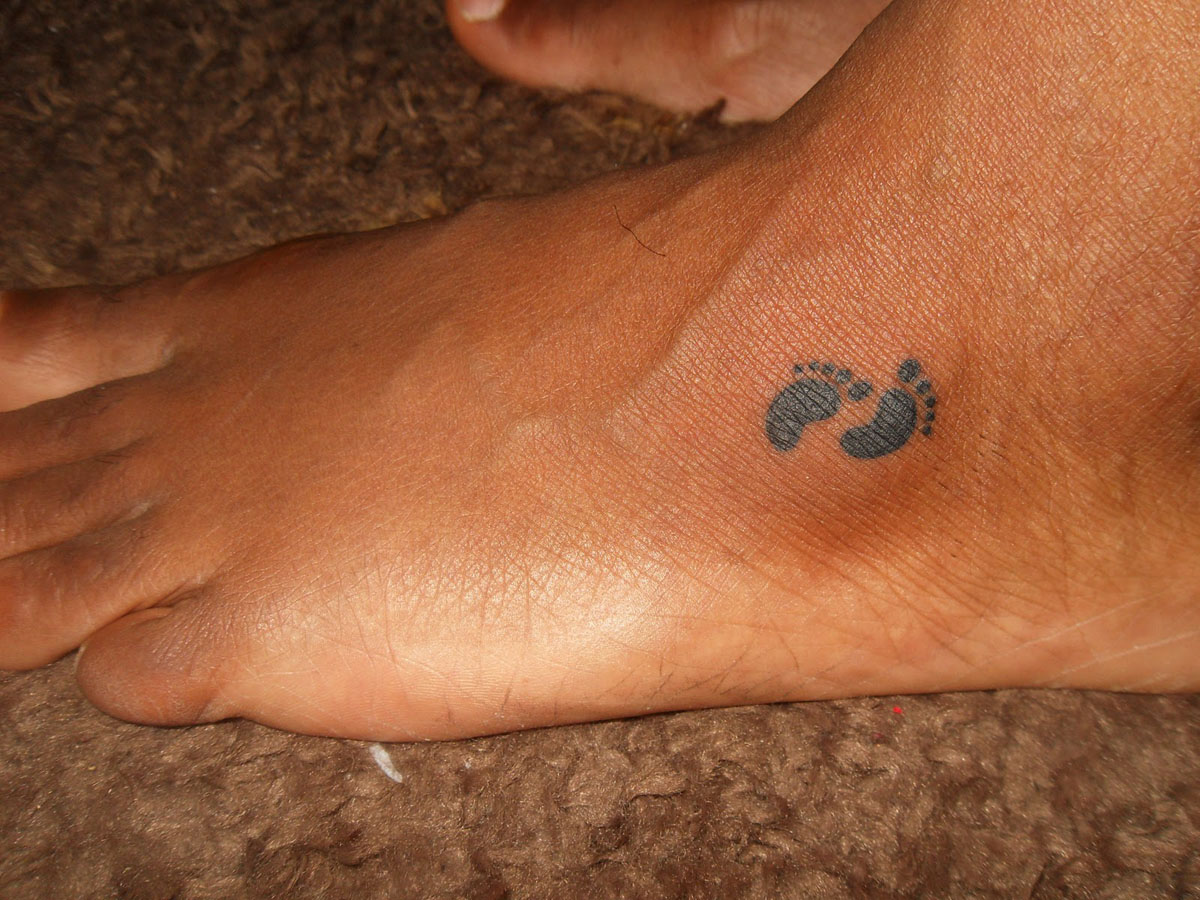 Little angel feet tattoo on foot