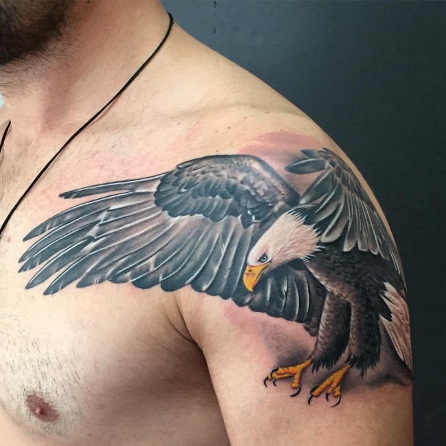 Man With Open Winged Eagle Tattoo On Left Shoulder