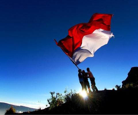 Men Flying Indonesian Flag On Independence Day