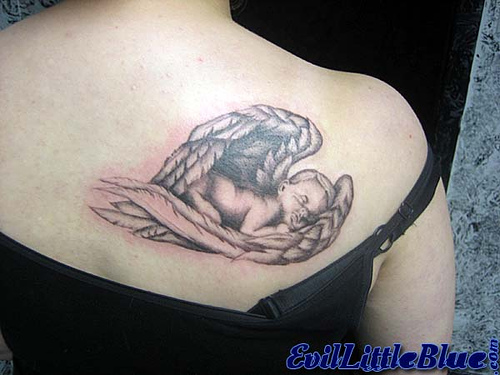 Miscarriage Baby Tattoo - Baby angel sleeping inside wings on back shoulder