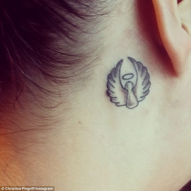 Miscarriage tattoo -Tiny flying angel behind her ear