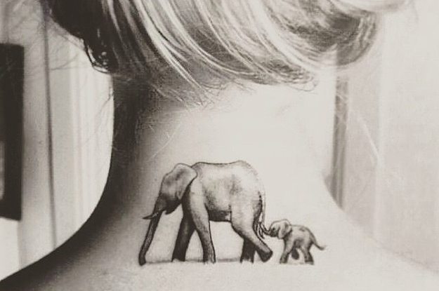 Mother Elephant With Baby Elephant Tattoo On Girl Nape