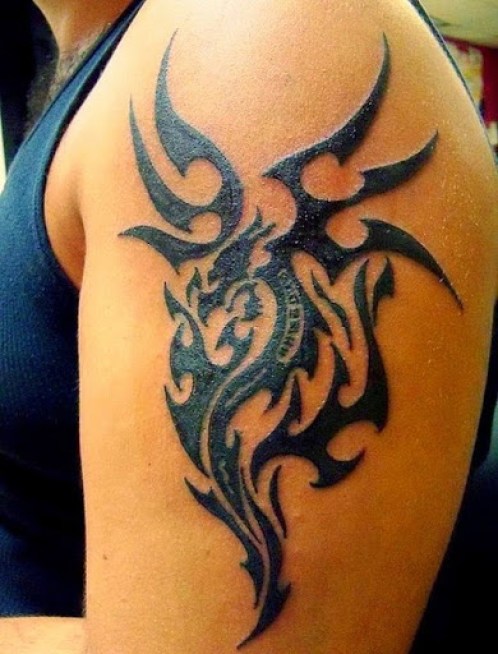 Nice Black Tribal Dragon Tattoo On Left Shoulder