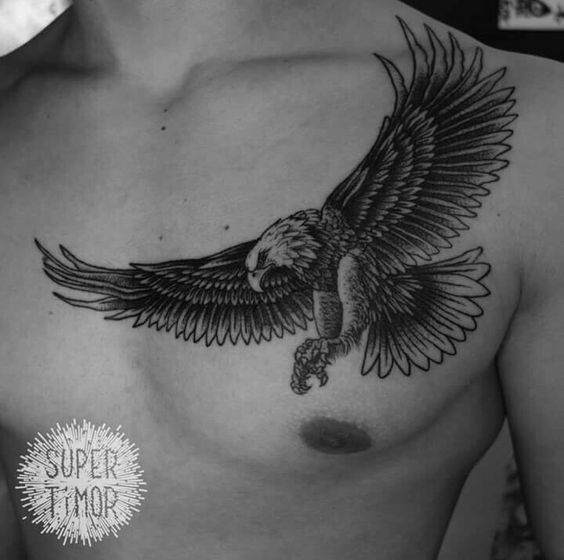 Nice Grey And Black Flying Eagle Tattoo On Man Chest