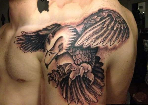 Nice Grey And Black Flying Eagle Tattoo On Man Left Shoulder