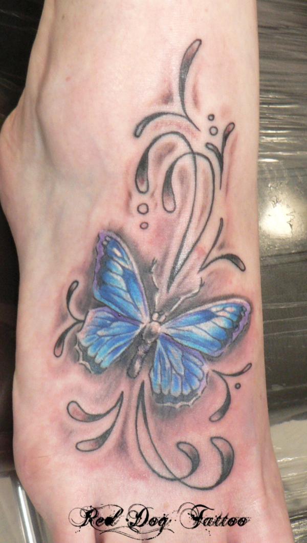Nice Grey And Blue Ink Butterfly Tattoo On Right Foot by Red Dog