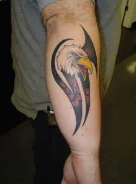 Nice Red And Black Ink Tribal Eagle Tattoo On Arm Sleeve
