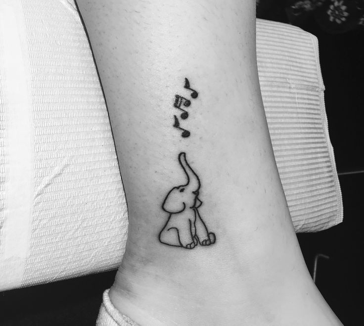 Outline Baby Elephant With Music Notes Tattooed On Side Leg