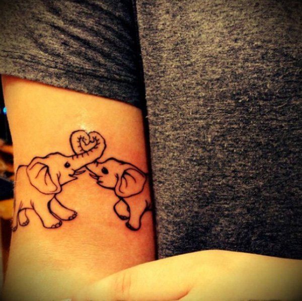Outline Elephant Couple Tattoo On Bicep