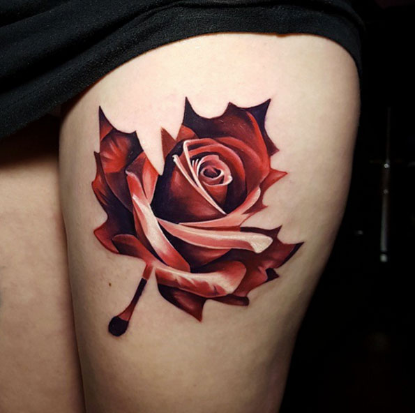 Red Rose In Maple Leaf Tattoo On Left Thigh