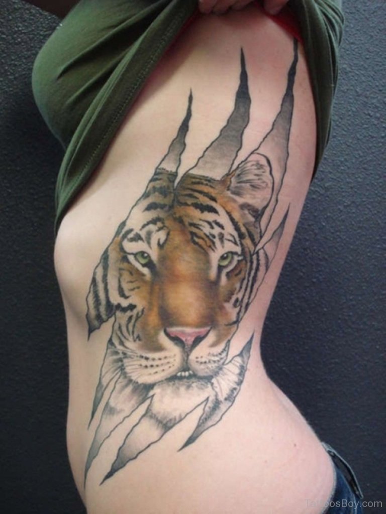 Ripped Skin Tiger Head Tattoo On Girl Side Rib