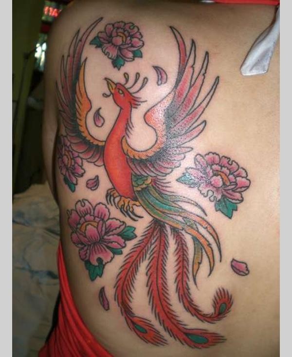 Rising Phoenix With Flowers Tattoo On Left Back Shoulder