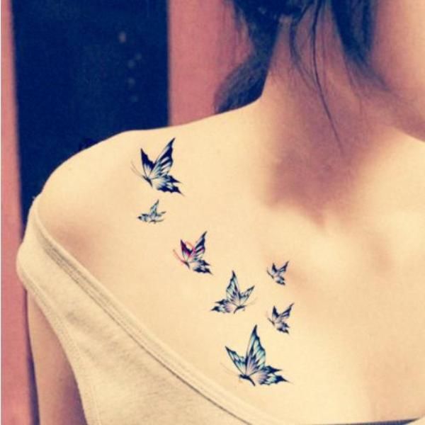 Small Blue Flying Butterflies Tattoos On Girl Front Shoulder