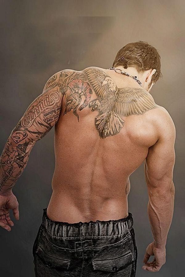 Stylish Man With Flying Eagle Tattoo On Upper Back