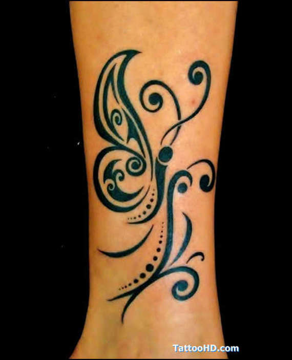 Swirl Tribal Butterfly Tattoo On Side Leg