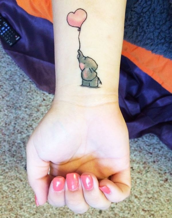 Tiny Elephant With Heart Shape Balloon Tattoo On Wrist