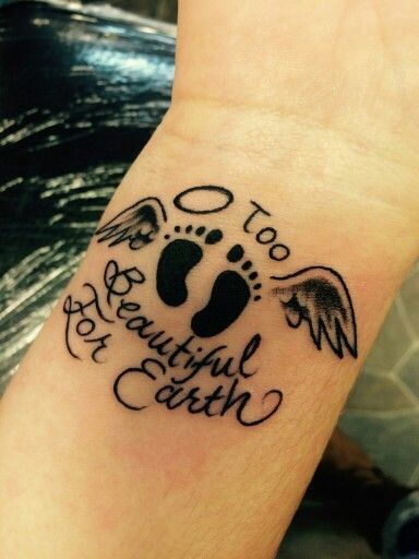 Too beautiful for earth - Baby feet with angel wings tattoo in forearm in memory of chld  Miscarried at 10 weeks