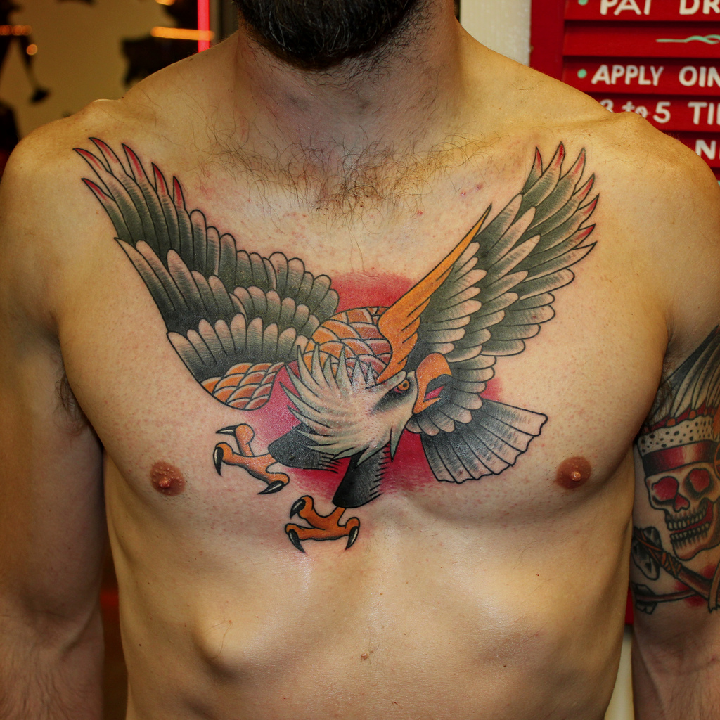 Traditional Colored Flying Eagle Tattoo On Man Chest