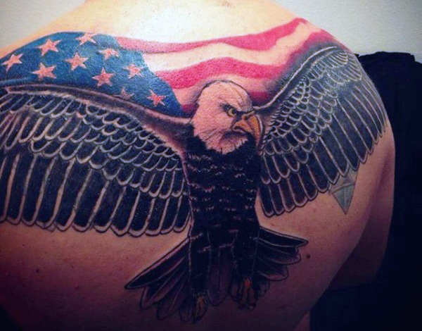 U.s Flag Flying Eagle Tattoo On Man Upper Back