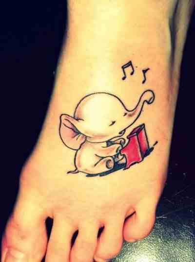 Up Trunk Baby Elephant Playing Piano Tattoo On Left Foot