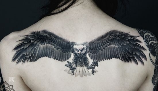 White and Black Flying Eagle Tattoo On Upper Back