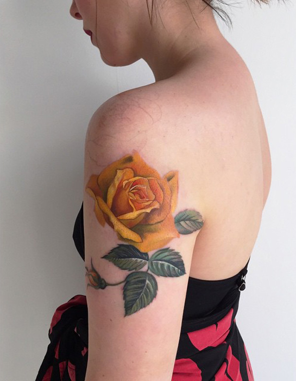Yellow Rose With Leaves Tattoo On Left Shoulder