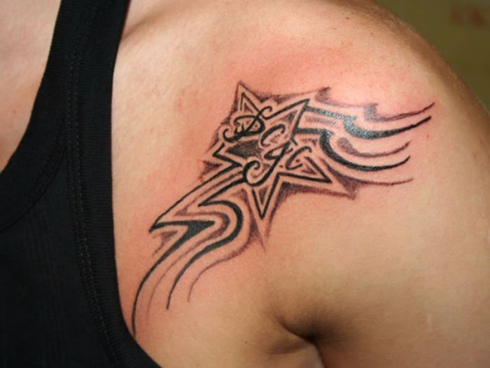 Amazing Black Tribal Shooting Stars Tattoo On Front Shoulder